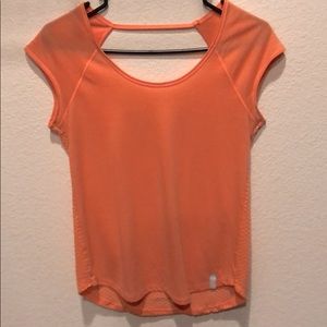 Peach colored Under Armour open back workout top